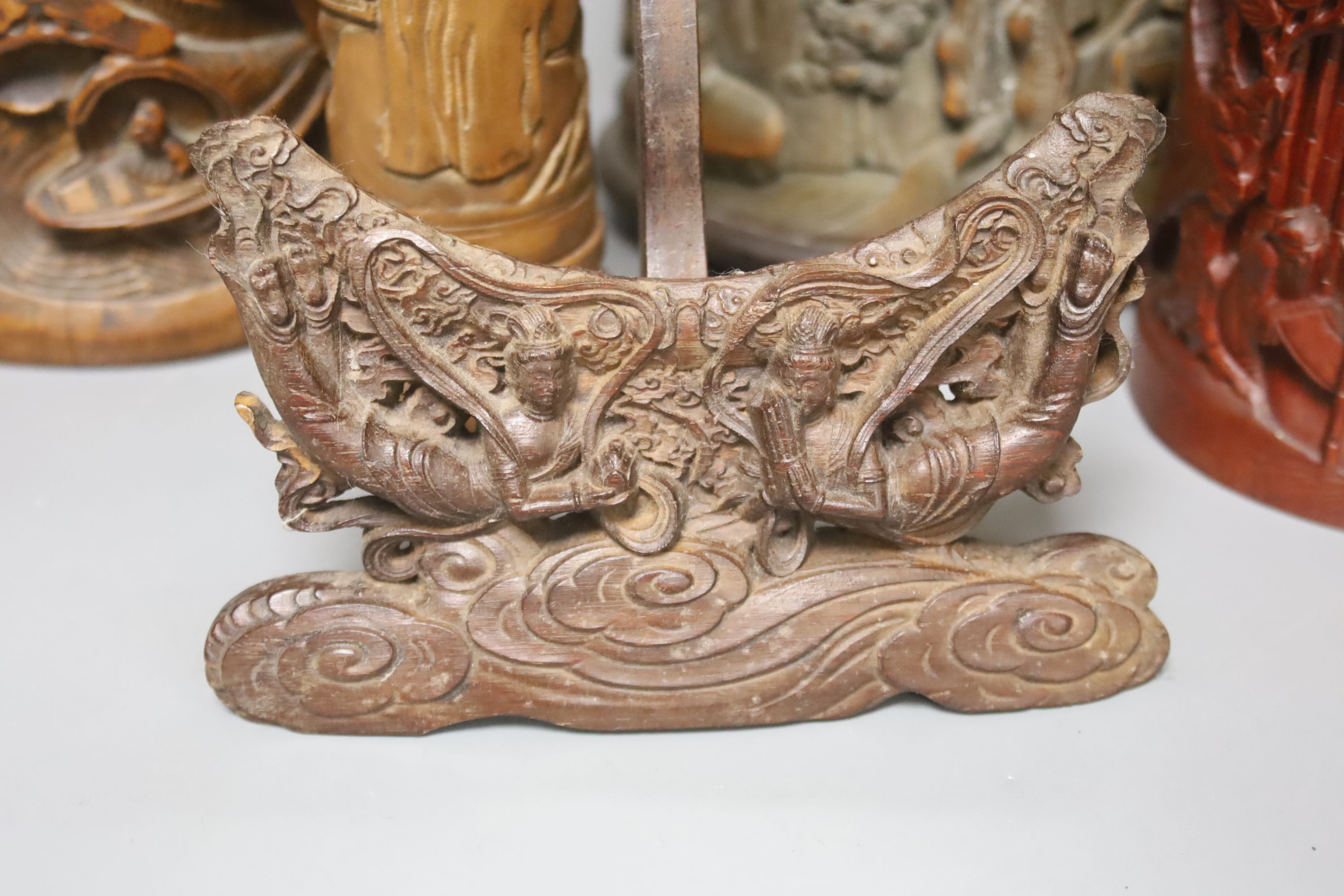 Three Chinese carved bamboo brushpots, largest 16cm diameter 17cm high, together with a carved bamboo scroll box and a carved hardwood plate stand (6)